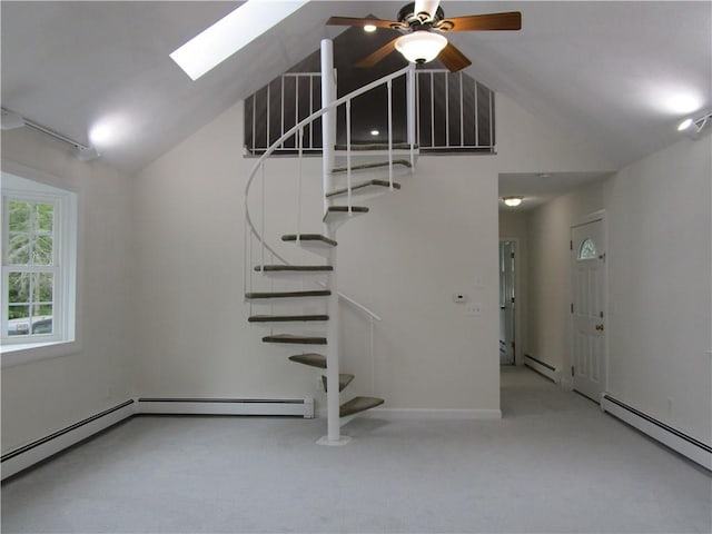 524 Middle Rd, East Greenwich, RI 02818 - stairs with a baseboard radiator, a skylight, carpet flooring, a ceiling fan, and high vaulted ceiling