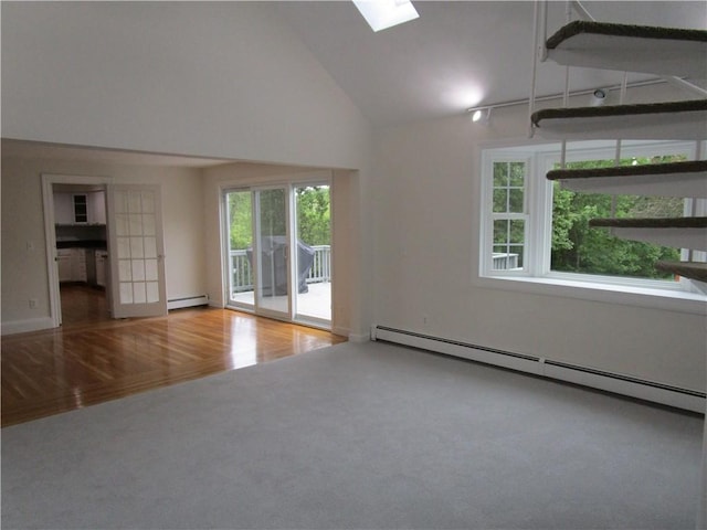 524 Middle Rd, East Greenwich, RI 02818 - empty room with baseboard heating, carpet, a skylight, high vaulted ceiling, and wood finished floors