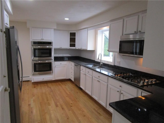 524 Middle Rd, East Greenwich, RI 02818 - kitchen featuring appliances with stainless steel finishes, a sink, white cabinetry, and recessed lighting