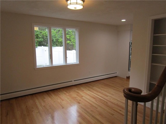 524 Middle Rd, East Greenwich, RI 02818 - spare room featuring a baseboard heating unit, light wood-type flooring, and recessed lighting