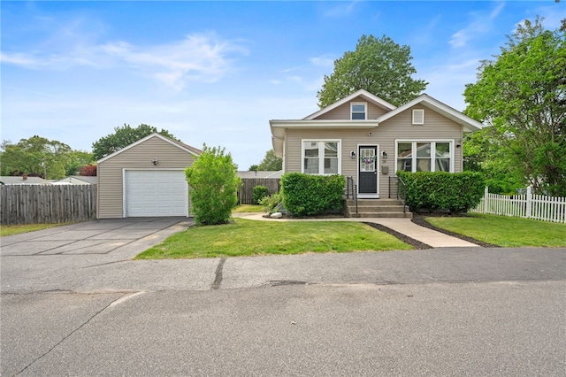 39 Sampson Ave, North Providence, RI 02911 - view of front of house with a detached garage and asphalt driveway