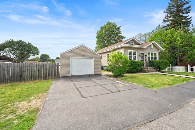 39 Sampson Ave, North Providence, RI 02911 - view of front of property with driveway, a detached garage, and an outbuilding