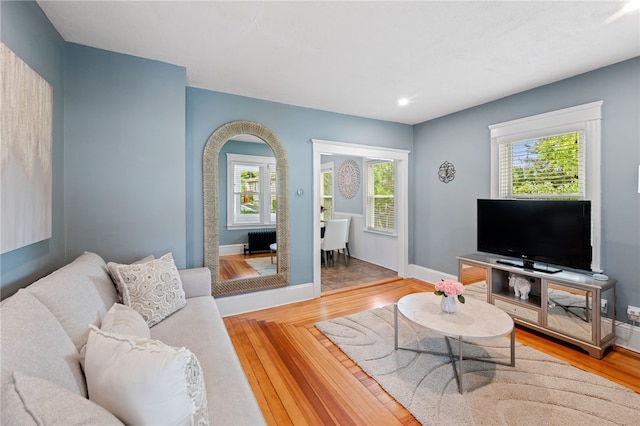 39 Sampson Ave, North Providence, RI 02911 - living area with baseboards, wood finished floors, and radiator heating unit