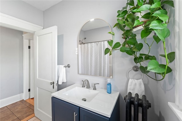 39 Sampson Ave, North Providence, RI 02911 - full bathroom featuring radiator, vanity, and baseboards
