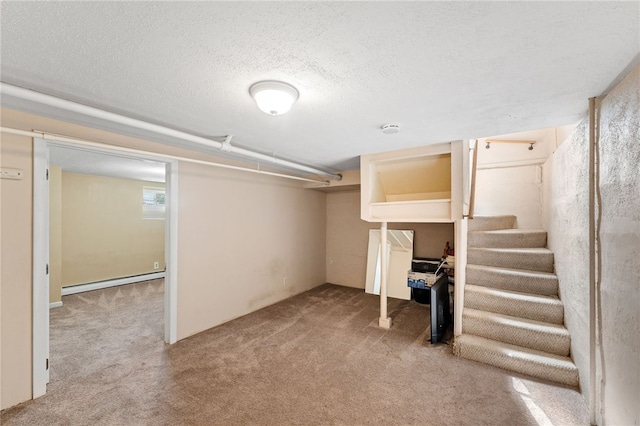 39 Sampson Ave, North Providence, RI 02911 - finished below grade area with a baseboard radiator, carpet, a textured ceiling, and stairway