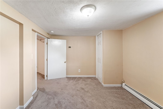 39 Sampson Ave, North Providence, RI 02911 - carpeted spare room with baseboard heating, a textured ceiling, and baseboards