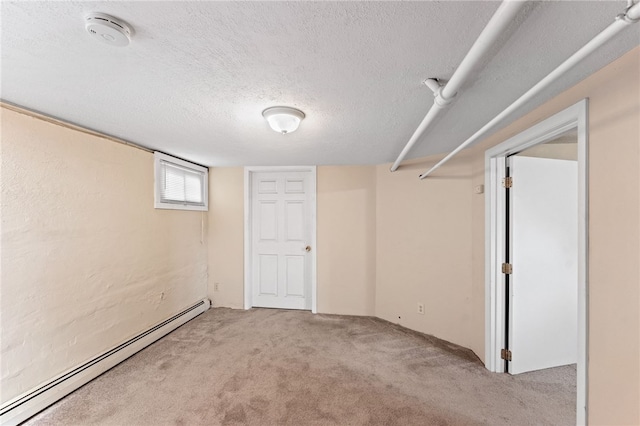 39 Sampson Ave, North Providence, RI 02911 - basement featuring a baseboard radiator, a textured ceiling, and light colored carpet