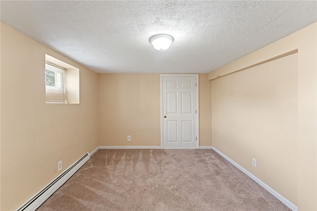 39 Sampson Ave, North Providence, RI 02911 - carpeted spare room with baseboard heating, a textured ceiling, and baseboards