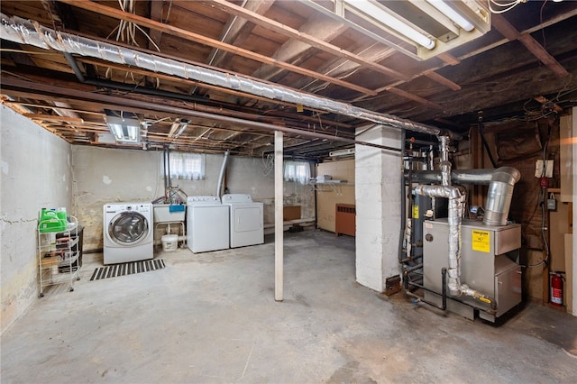 39 Sampson Ave, North Providence, RI 02911 - below grade area featuring separate washer and dryer, radiator, and a sink