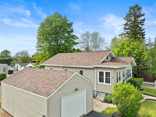 39 Sampson Ave, North Providence, RI 02911 - back of property featuring roof with shingles and a chimney