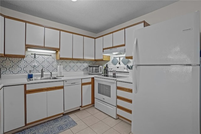 724 Beverage Hill Ave Unit 304, Pawtucket, RI 02861 - kitchen with white appliances, under cabinet range hood, a sink, white cabinetry, and light countertops