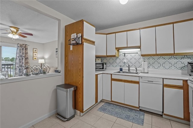 724 Beverage Hill Ave Unit 304, Pawtucket, RI 02861 - kitchen with dishwasher, a sink, tasteful backsplash, light countertops, and white cabinetry