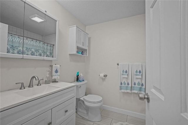 724 Beverage Hill Ave Unit 304, Pawtucket, RI 02861 - full bath with vanity, toilet, a textured ceiling, tile patterned floors, and baseboards