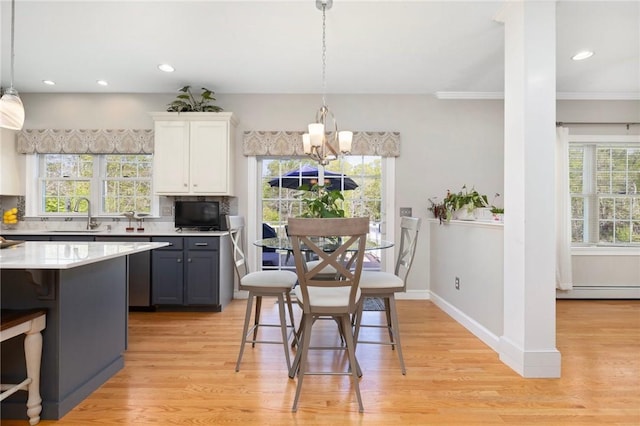 114 Teaberry Dr, Tiverton, RI 02878 - dining area with light wood-style floors, healthy amount of natural light, recessed lighting, and crown molding