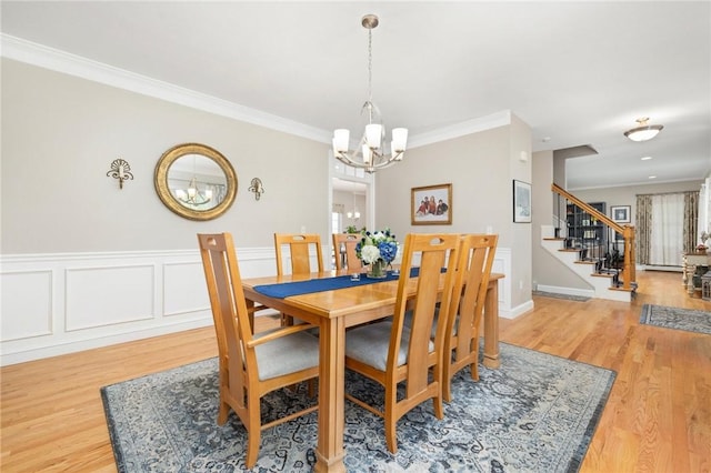 114 Teaberry Dr, Tiverton, RI 02878 - dining space with a chandelier, stairs, crown molding, and wood finished floors