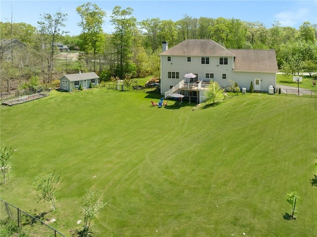 114 Teaberry Dr, Tiverton, RI 02878 - back of property with a chimney and a deck