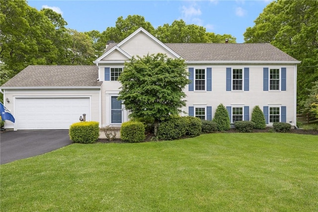 299 S Christopher Ave, Tiverton, RI 02878 - colonial inspired home with a chimney, driveway, an attached garage, a front lawn, and a shingled roof