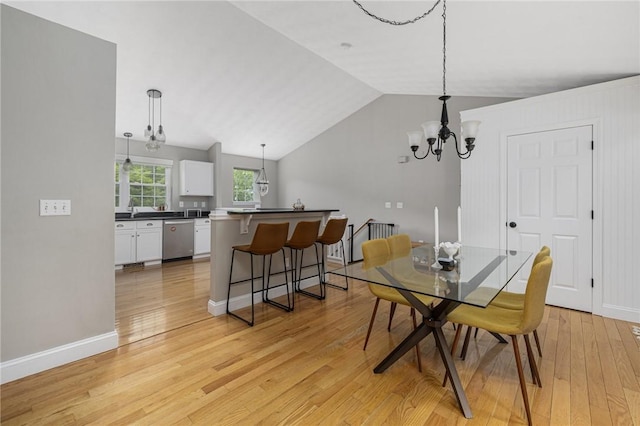 299 S Christopher Ave, Tiverton, RI 02878 - dining area with a chandelier, light wood-type flooring, lofted ceiling, and baseboards
