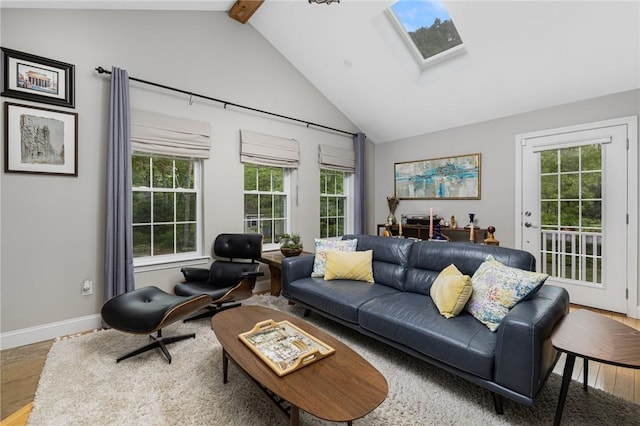 299 S Christopher Ave, Tiverton, RI 02878 - living area with a skylight, healthy amount of natural light, wood finished floors, beamed ceiling, and high vaulted ceiling