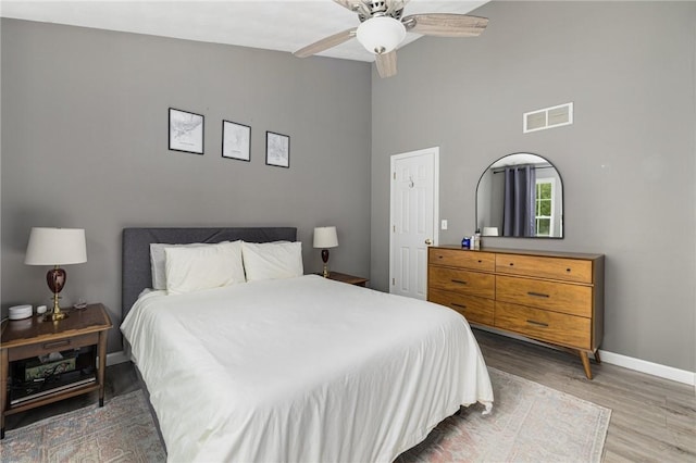 299 S Christopher Ave, Tiverton, RI 02878 - bedroom with baseboards, wood finished floors, high vaulted ceiling, and a ceiling fan