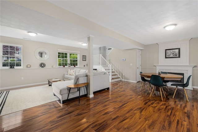 299 S Christopher Ave, Tiverton, RI 02878 - living area featuring wood finished floors, stairway, a fireplace, and baseboards