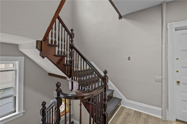 1413 Broad St, Providence, RI 02905 - stairs featuring wood finished floors and baseboards