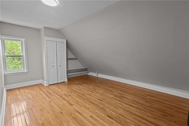 1413 Broad St, Providence, RI 02905 - additional living space featuring light wood finished floors, vaulted ceiling, and baseboards