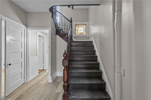 1413 Broad St, Providence, RI 02905 - staircase with wood finished floors and baseboards