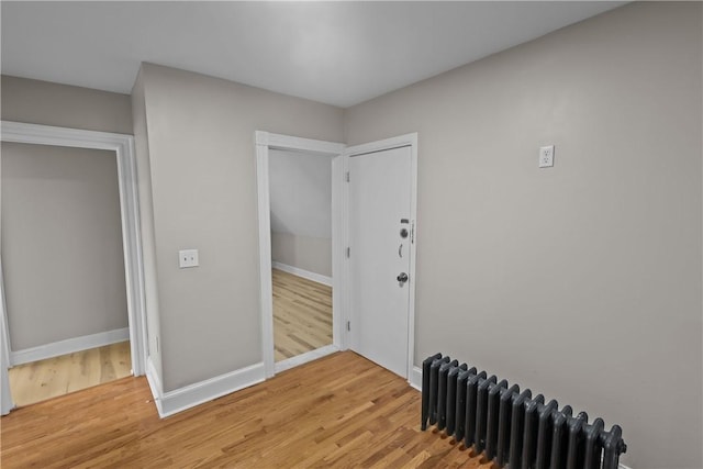 1413 Broad St, Providence, RI 02905 - entryway featuring radiator, light wood-type flooring, and baseboards