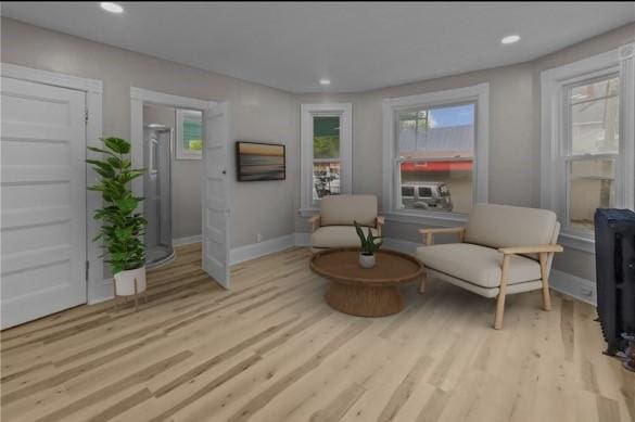 1413 Broad St, Providence, RI 02905 - living area with plenty of natural light, wood finished floors, baseboards, and recessed lighting