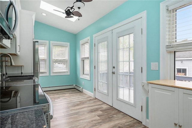 130 Alice Ave, Woonsocket, RI 02895 - doorway to outside featuring a skylight, lofted ceiling, french doors, light wood-style flooring, and a ceiling fan