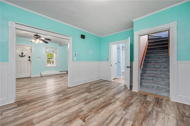 130 Alice Ave, Woonsocket, RI 02895 - empty room featuring wood finished floors, a wainscoted wall, stairway, ornamental molding, and a ceiling fan