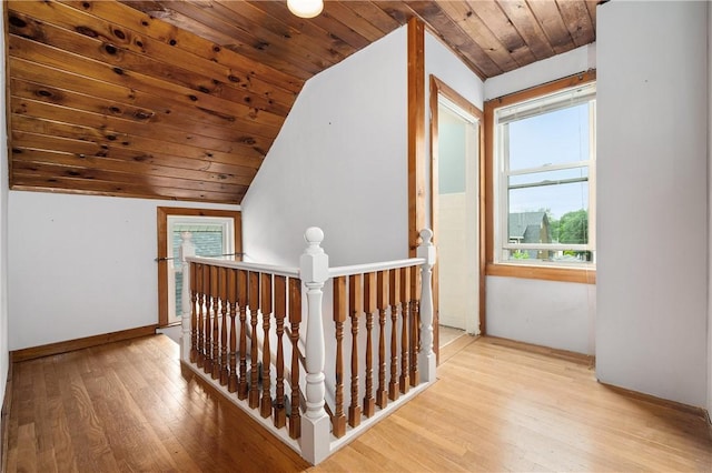 130 Alice Ave, Woonsocket, RI 02895 - hallway featuring an upstairs landing, lofted ceiling, wood-type flooring, wood ceiling, and baseboards