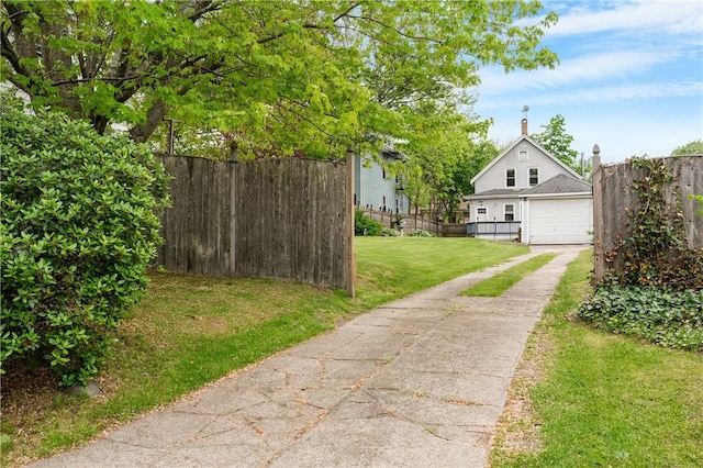 130 Alice Ave, Woonsocket, RI 02895 - view of yard with concrete driveway and a detached garage