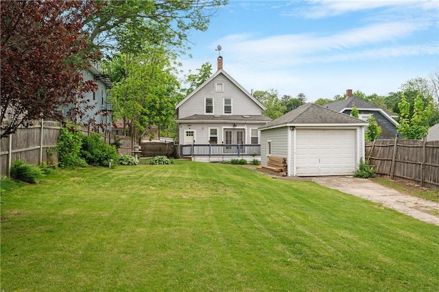130 Alice Ave, Woonsocket, RI 02895 - back of house featuring a deck, concrete driveway, a detached garage, and an outdoor structure