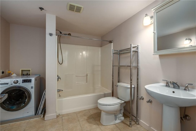 28 Bayley St Unit 304, Pawtucket, RI 02860 - bathroom with washer / dryer, toilet, washtub / shower combination, tile patterned floors, and baseboards
