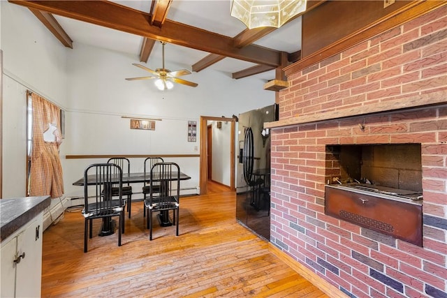 9 Melody Ln, Johnston, RI 02919 - dining space featuring light wood-style flooring, beam ceiling, ceiling fan, and baseboard heating