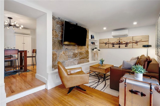 75 Pelham St Unit A, Newport, RI 02840 - living room with a wall unit AC, wood-type flooring, a chandelier, and recessed lighting