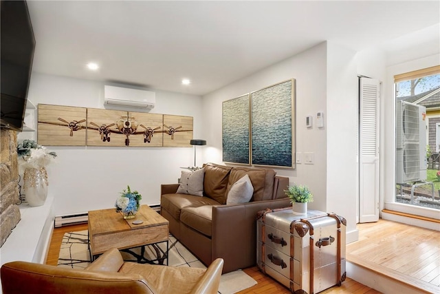 75 Pelham St Unit A, Newport, RI 02840 - living room featuring a wall unit AC, a baseboard radiator, light wood-style flooring, and recessed lighting