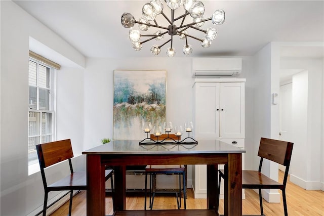 75 Pelham St Unit A, Newport, RI 02840 - dining area featuring a wall mounted air conditioner, a chandelier, light wood-style flooring, baseboards, and baseboard heating