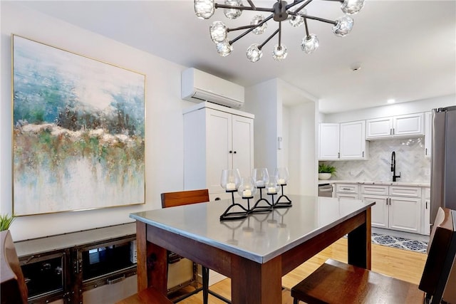75 Pelham St Unit A, Newport, RI 02840 - dining space featuring a wall mounted AC, light wood-style flooring, and a chandelier