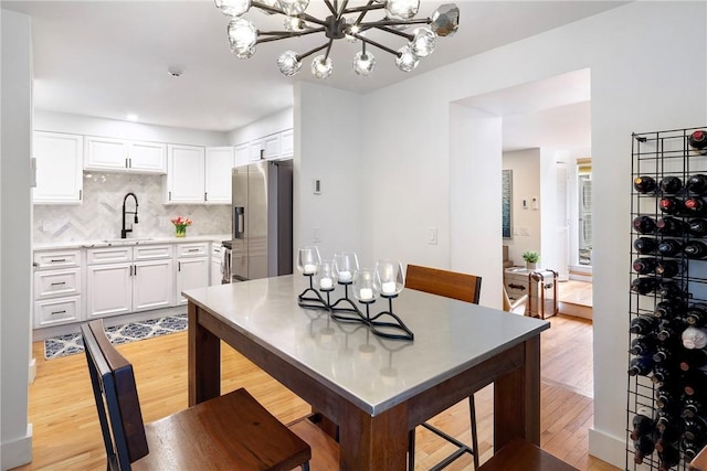 75 Pelham St Unit A, Newport, RI 02840 - dining room featuring a chandelier and light wood-type flooring