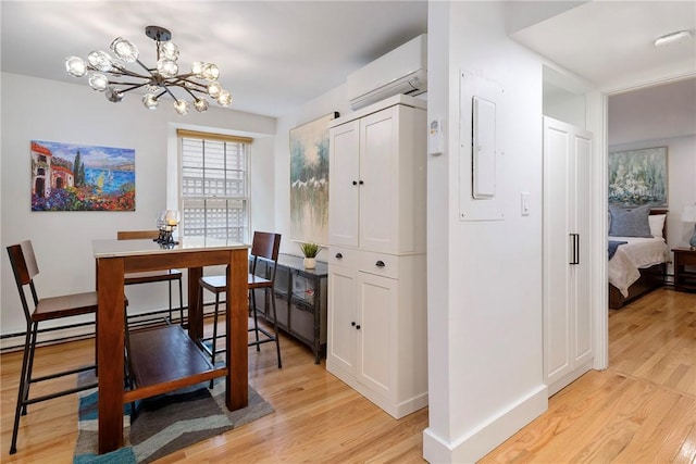 75 Pelham St Unit A, Newport, RI 02840 - dining space featuring a chandelier, light wood-style flooring, electric panel, and baseboards