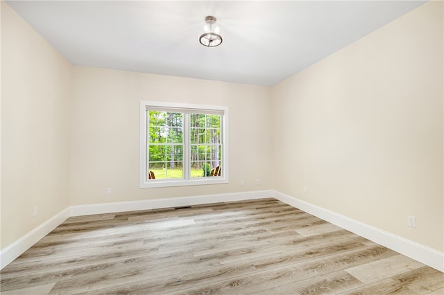 1332 S Rd, South Kingstown, RI 02879 - unfurnished room with wood finished floors and baseboards