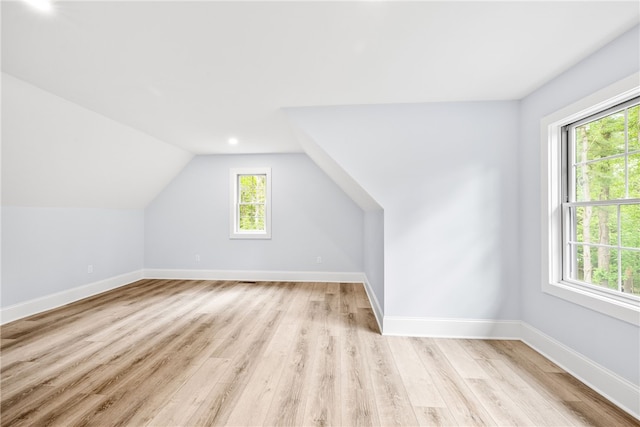 1332 S Rd, South Kingstown, RI 02879 - additional living space with light wood-style flooring, baseboards, and vaulted ceiling