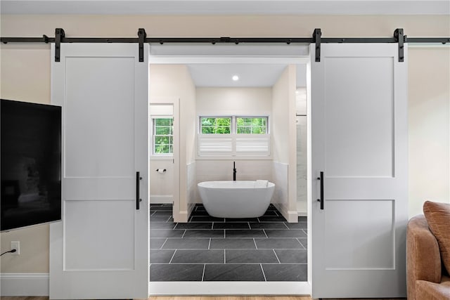 1332 S Rd, South Kingstown, RI 02879 - bathroom featuring a soaking tub, baseboards, tile patterned flooring, and recessed lighting