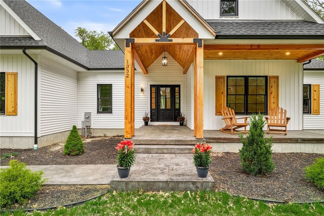 1332 S Rd, South Kingstown, RI 02879 - doorway to property with covered porch and roof with shingles