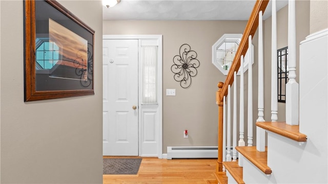 605 Gardner Rd, Exeter, RI 02822 - entrance foyer featuring a baseboard radiator, stairway, light wood-style flooring, and baseboards