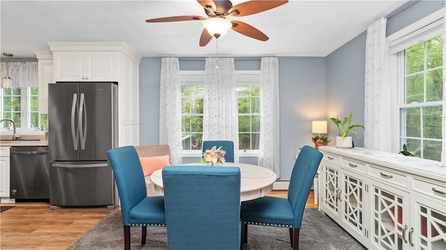 605 Gardner Rd, Exeter, RI 02822 - dining space with light wood-style floors, healthy amount of natural light, and a ceiling fan