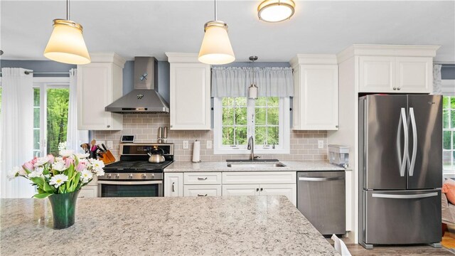605 Gardner Rd, Exeter, RI 02822 - kitchen featuring stainless steel appliances, wall chimney exhaust hood, a sink, and healthy amount of natural light